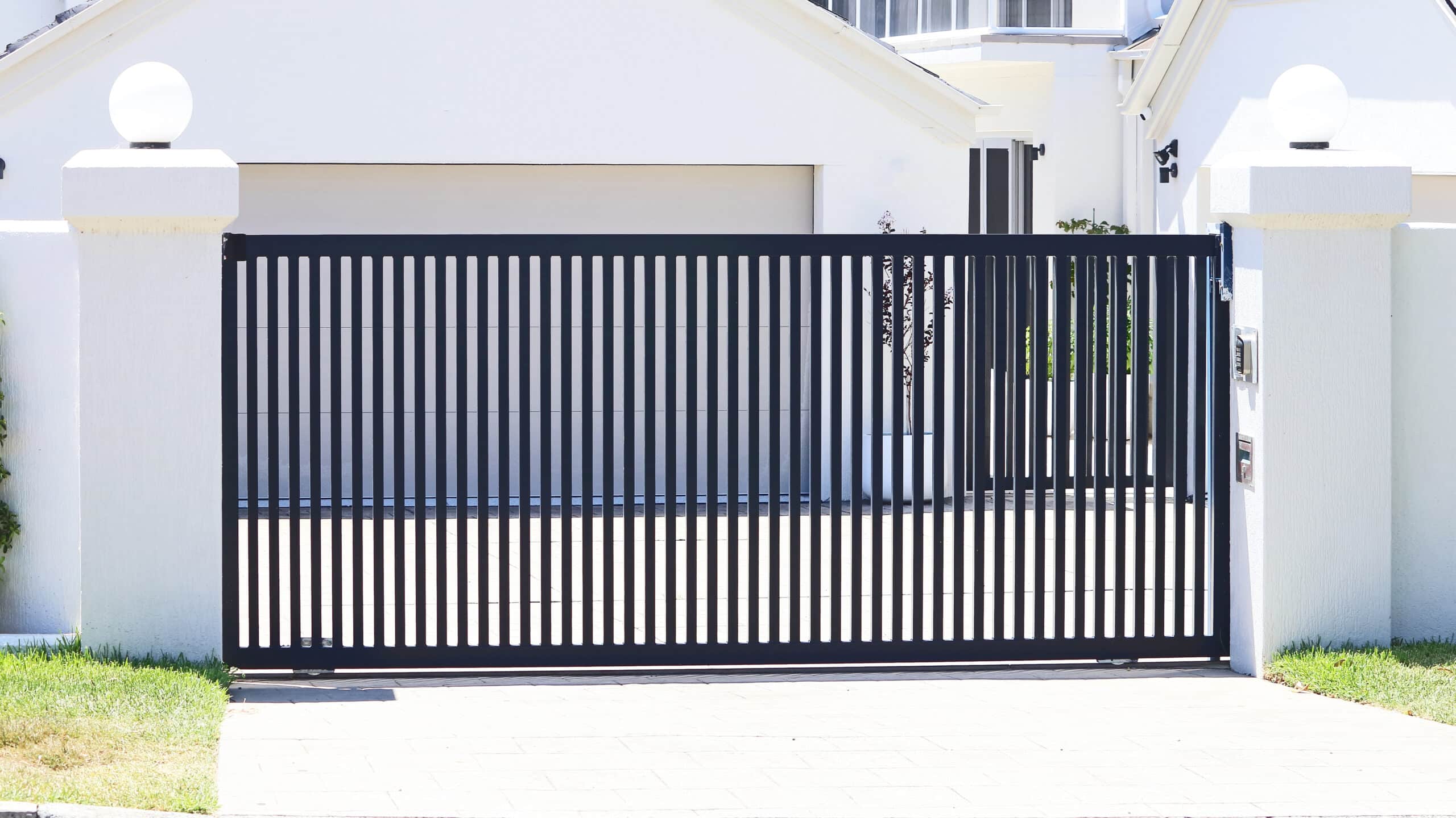 Sliding driveway gate by R3 Access Inc., offering enhanced security and curb appeal.