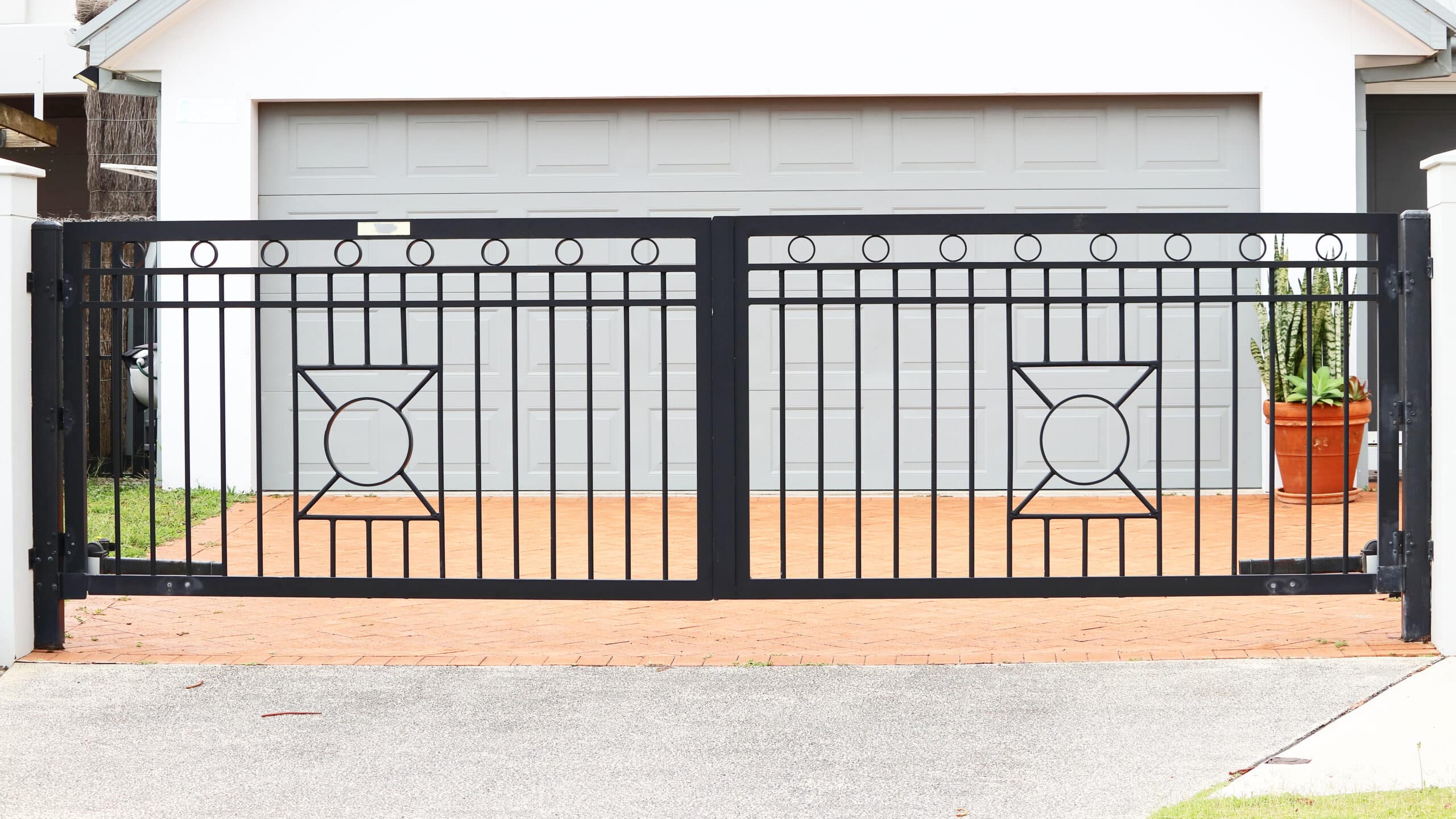 Swing driveway gate by R3 Access Inc., offering a blend of security and elegance.